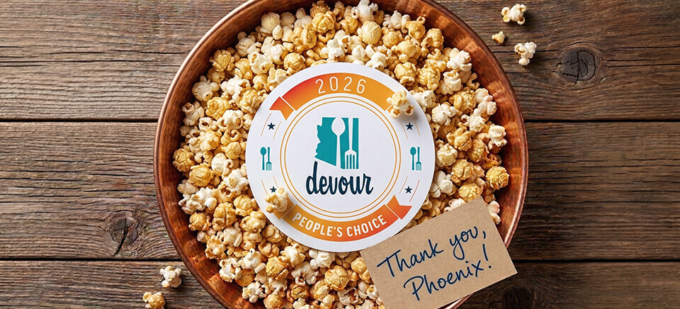 Kettle Heroes Popcorn in a copper bowl with the Devour Culinary Classic 2026 People's Choice Award badge and a handwritten Thank you Phoenix note